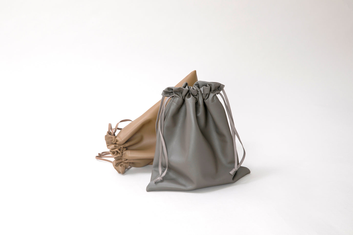 MEN/WOMEN ERA. NAPPA CALF RED CROSS DRAWSTRING BAG
