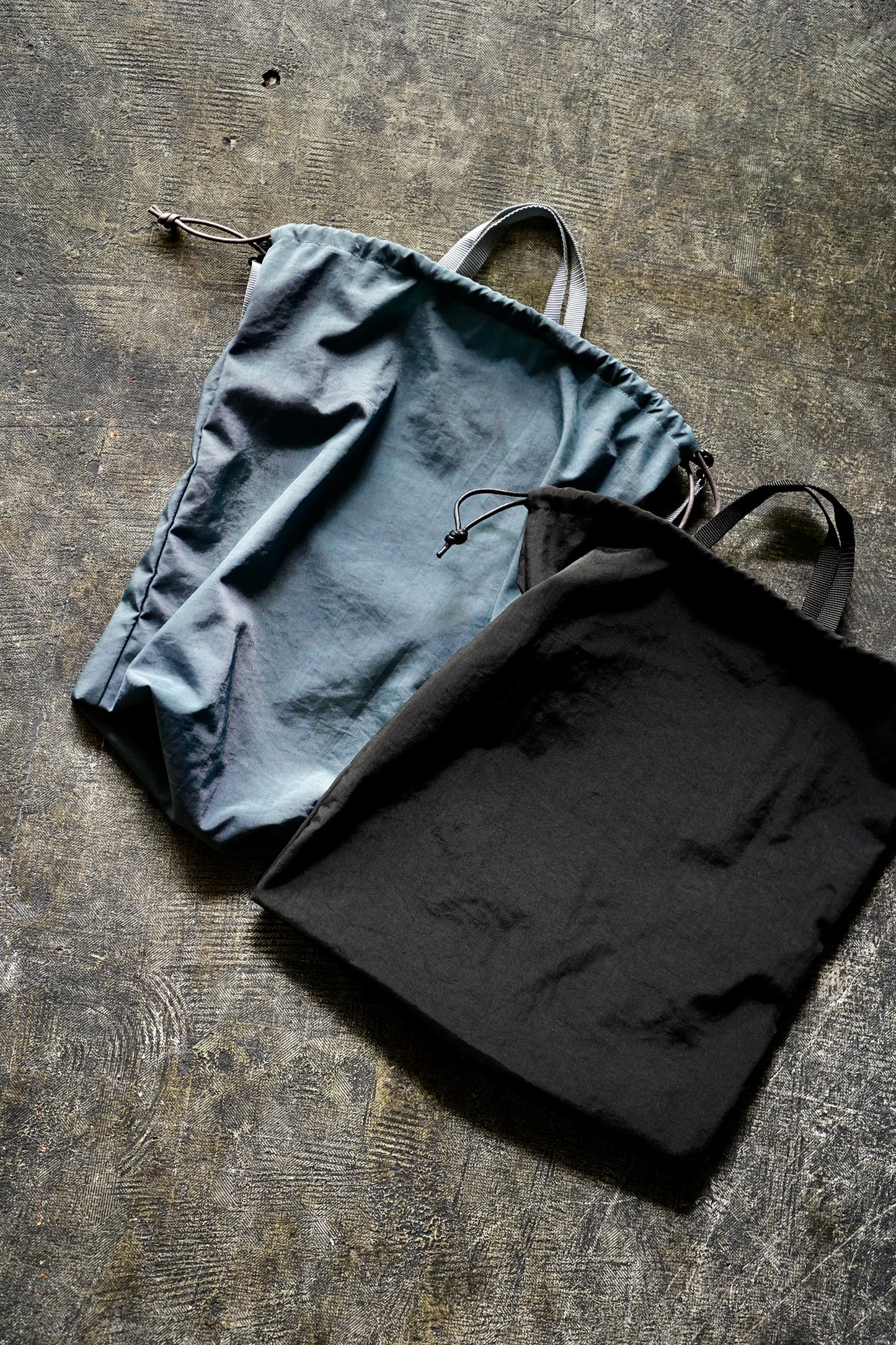MEN/WOMEN　ERA.　TAS FLAT KINCHAKU LARGE