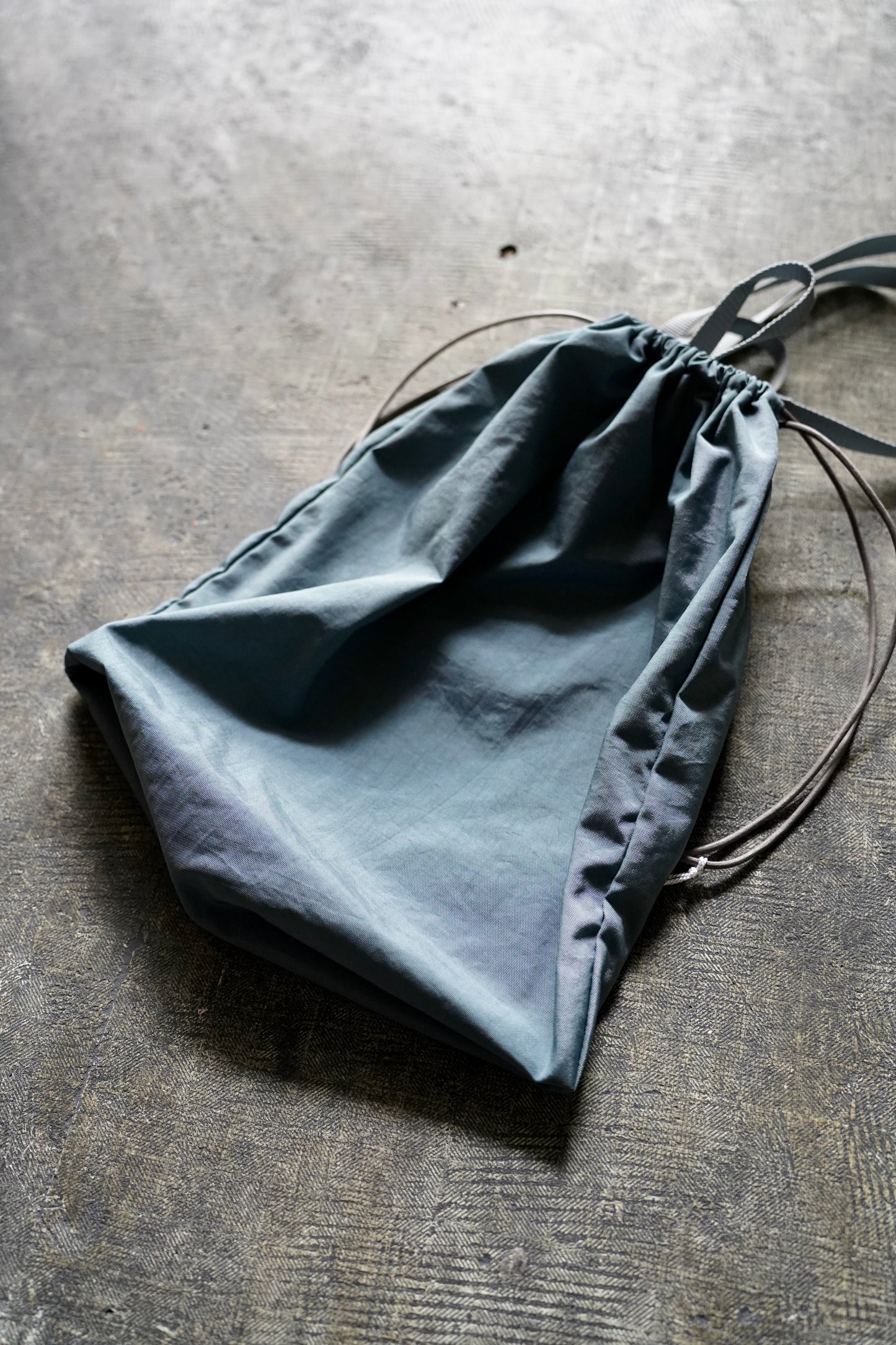 MEN/WOMEN　ERA.　TAS FLAT KINCHAKU LARGE